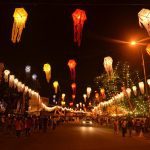 A street lighten up by lanterns